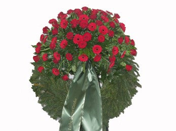 Trauerkranz mit roten Rosen und Gerbera  Gerne können Sie unter Bemerkungen eine andere Blumenfarbe oder auch eine andere Blumenart eingeben. Wir werden Ihre Wünsche so ähnlich wie möglich berücksichtigen.  Wenn Sie eine Trauerschleife dazu bestellen möchten, wählen Sie diese bei den Artikeln aus. Den Schleifentext können Sie bei der Bestellung im Feld Kartentext eingeben.